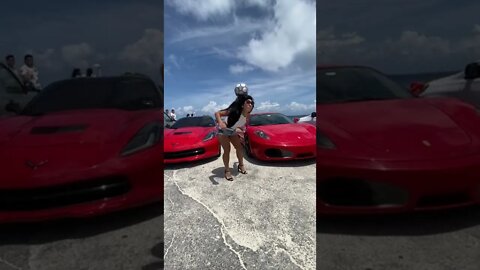 Cute girl doing tricks and nice cars. What else do you want?