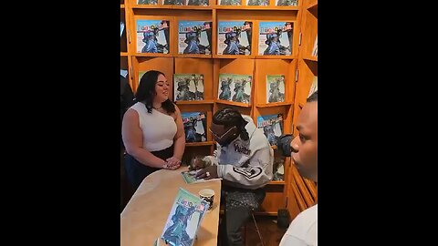 Burnaboy signing autographs