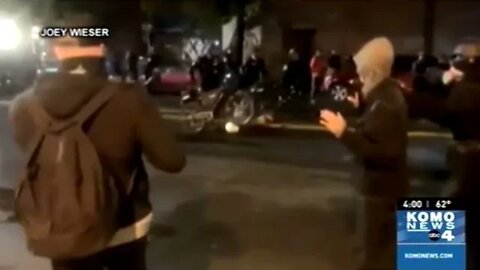 Video Shows Seattle Police Officer Walk His Bicycle Over A Protester's Head!
