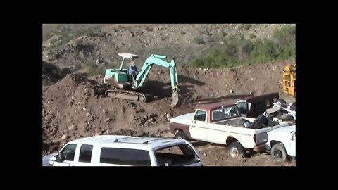 Yanmar YB 451 Excavator Working On Top Of A berm