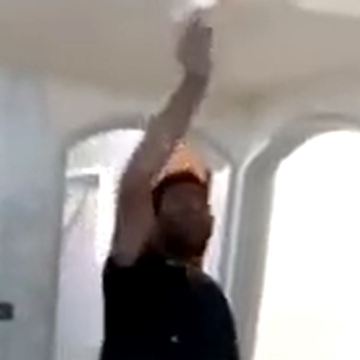 Guys singing and dancing while working