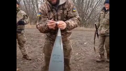 Ukraine soldiers spread pigs fat on artillery shells