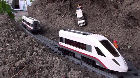 Crashes Lego garden railway around the pond