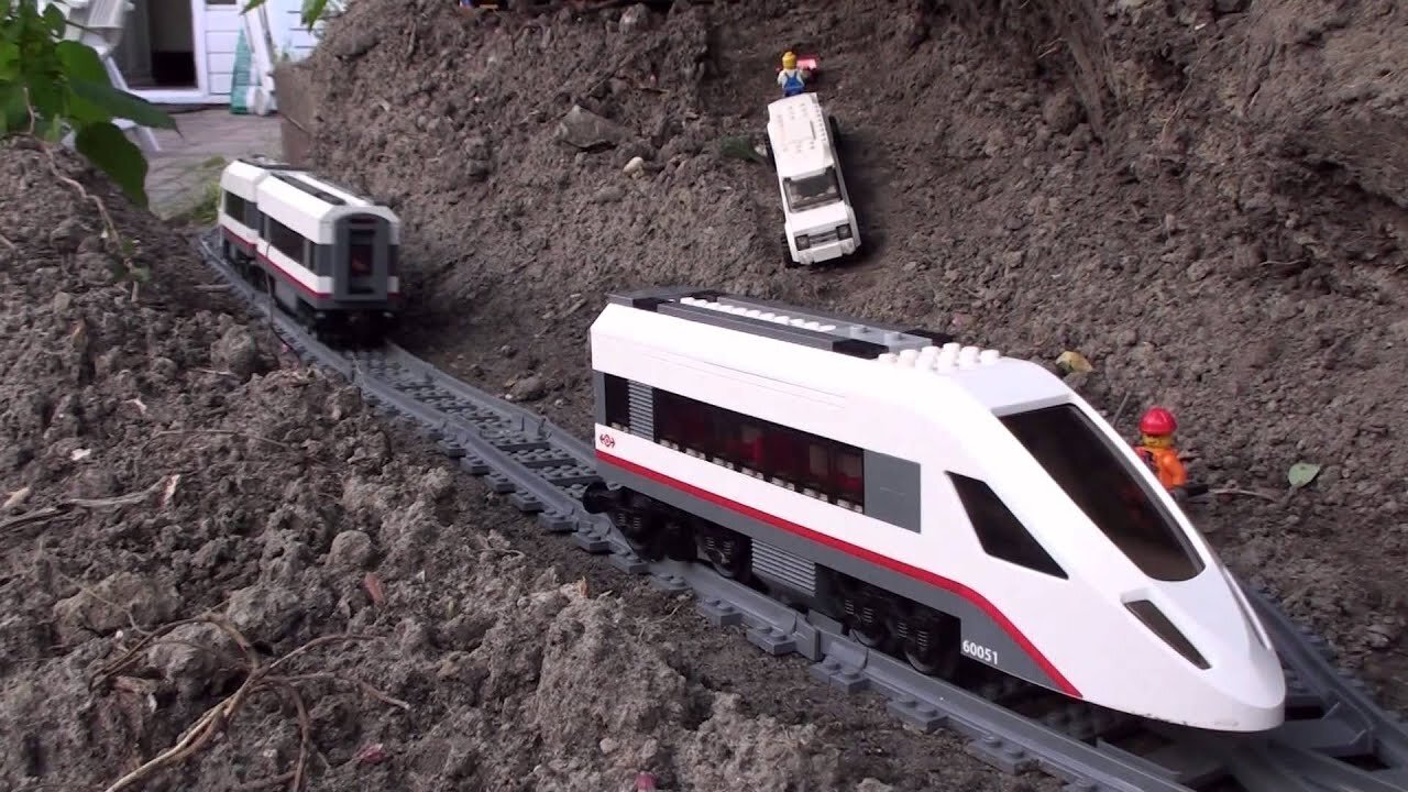 Crashes Lego garden railway around the pond