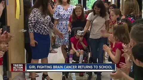 Tampa girl fighting brain cancer welcomed back to school with applause, hugs from fellow students