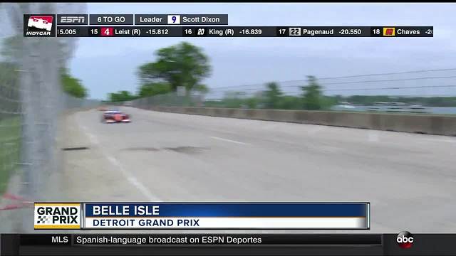 Scott Dixon joins Brad Galli and Justin Rose in the Detroit Grand Prix winner's circle