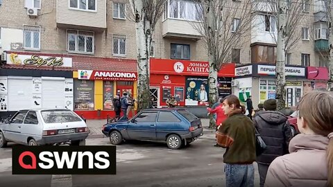 Ukrainian protesters have been filmed shouting at armed Russian soldiers to “go home”