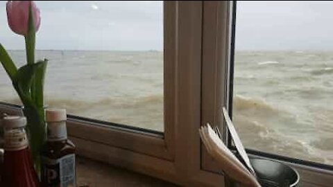 Seaside restaurant almost submerged at rough tide
