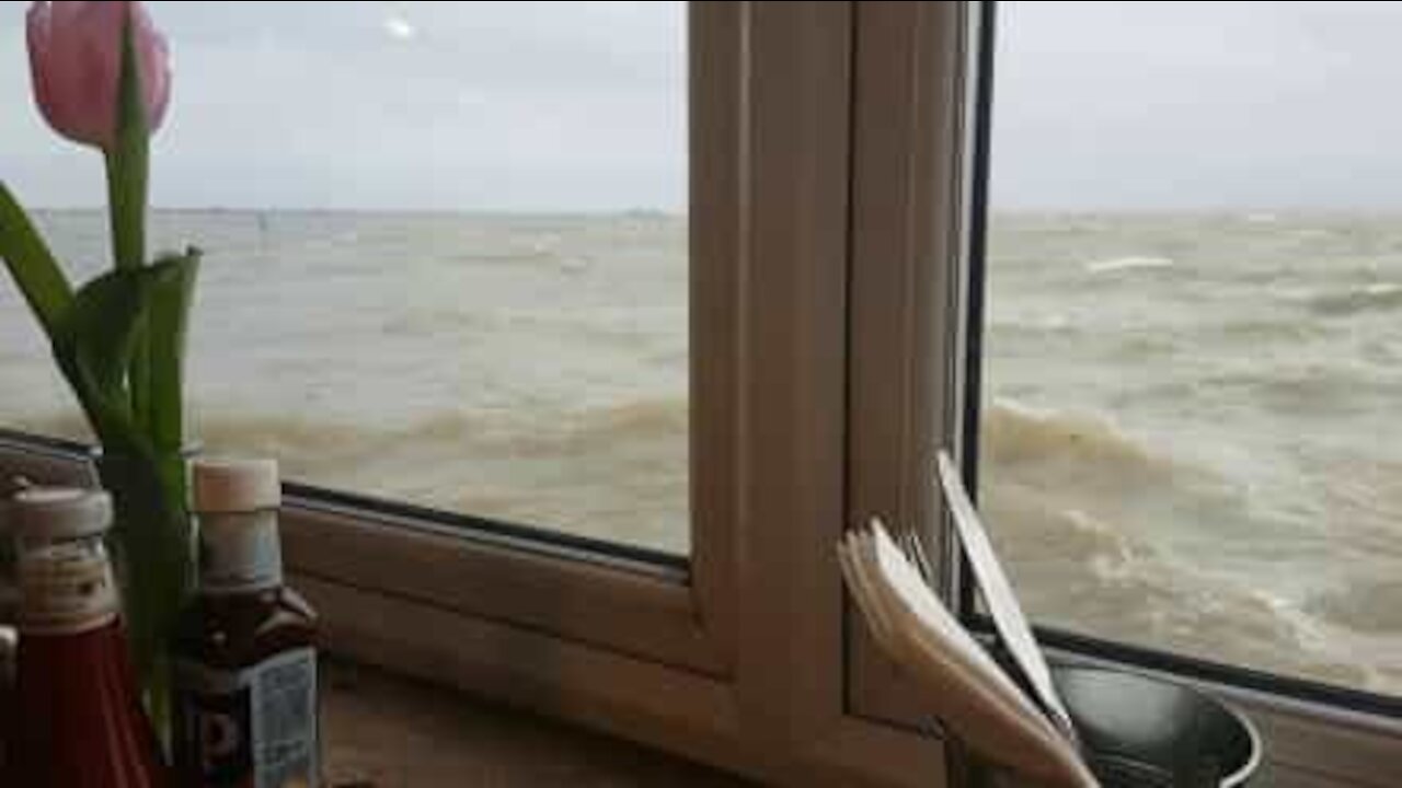 Seaside restaurant almost submerged at rough tide