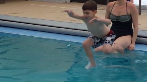 Brother Jumps Into Pool But His Little Sister Tumbles In