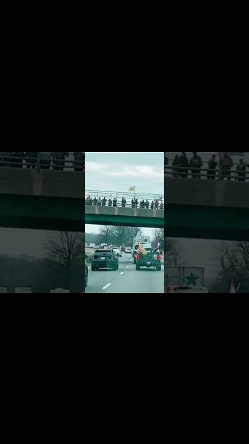 March 6, 2022 Peoples Convoy supporter on the overpass bridge