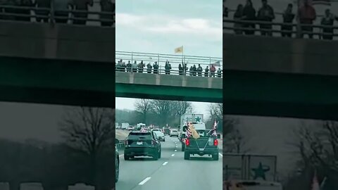 March 6, 2022 Peoples Convoy supporter on the overpass bridge