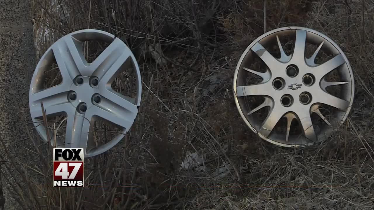 Large pothole inspires hubcap display