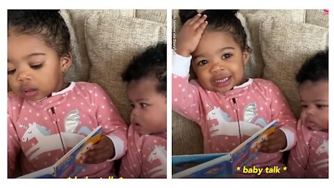 This 2year old girl trying to read to her little sister is too cute