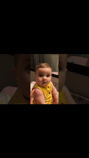 Cute adorable baby child with warm white and pink hat with cute baby girl