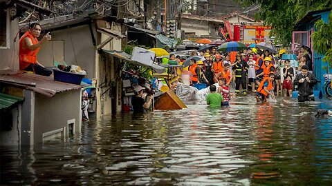 Storm-triggered floods in Philippines spark frantic calls to rescue trapped people, some on roofs