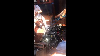 Dropping new engine into the engine bay