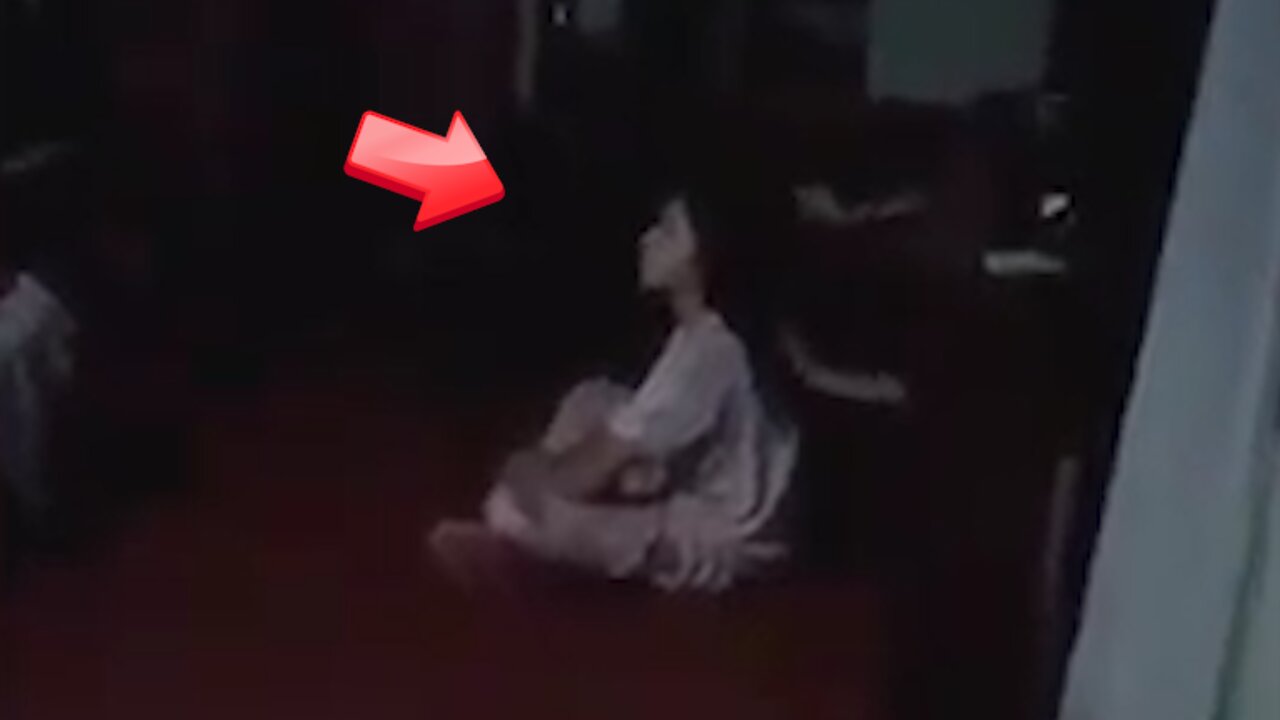 Who are the hands playing with the back of the girl is hair while she meditates [ghost]