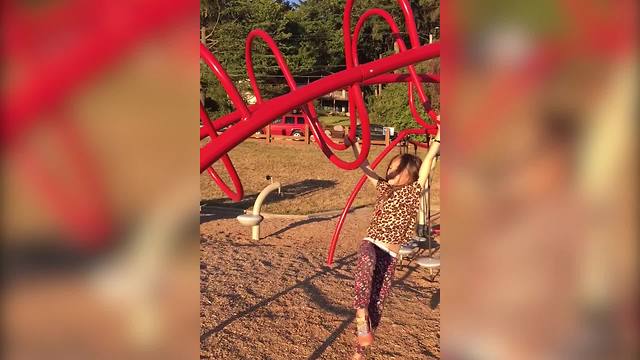 Adorable Girl Falls Off Curved Monkey Bars