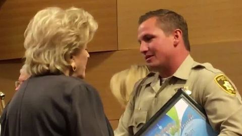 Las Vegas police officer honored for saving man who pointed a gun at him