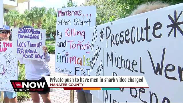 Protestors call for arrest of men in viral shark dragging video