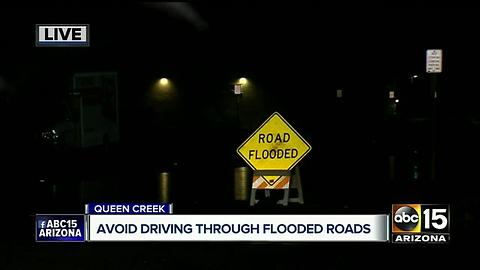 Water floods streets in Queen Creek