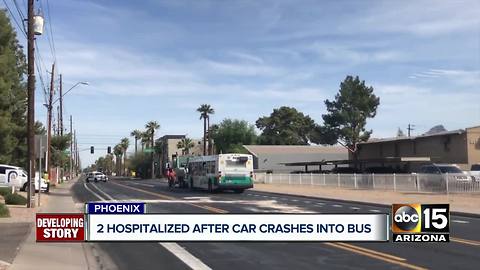 Two hospitalized after car crashes into Phoenix bus