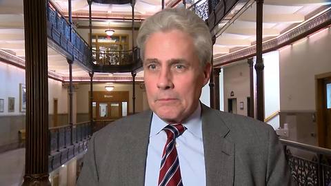 Ald. Bob Bauman reacts to goat inside Milwaukee restaurant
