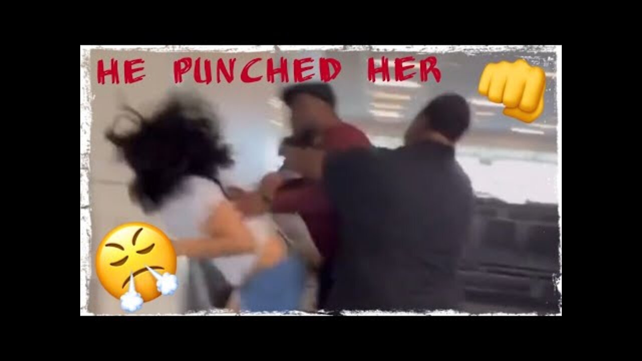 Guy beats up female at airport Altercation