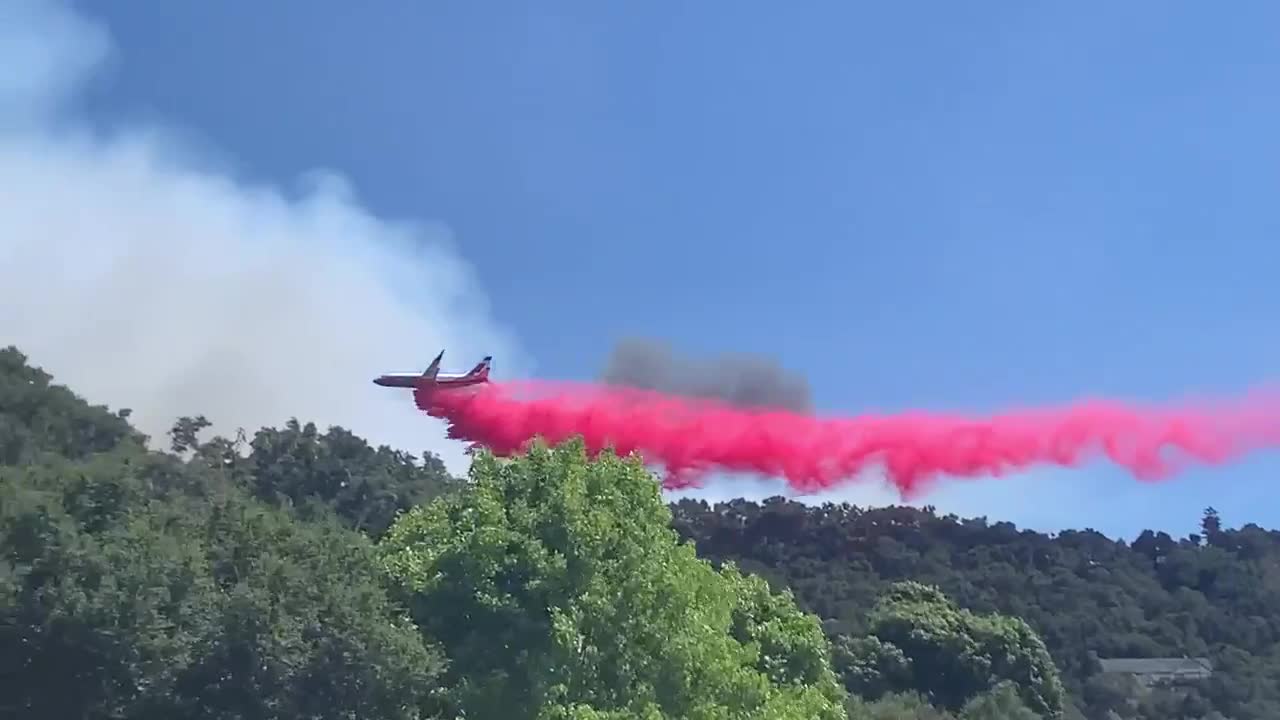 Plane attempts to put out Avila Fire near Pismo Beach, CA