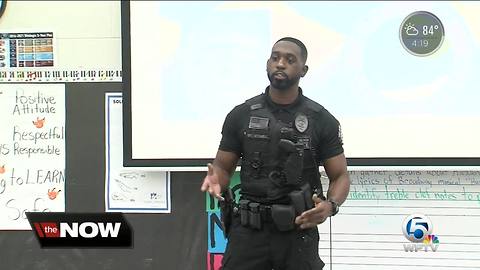 Delray Beach police officers speak to children at school