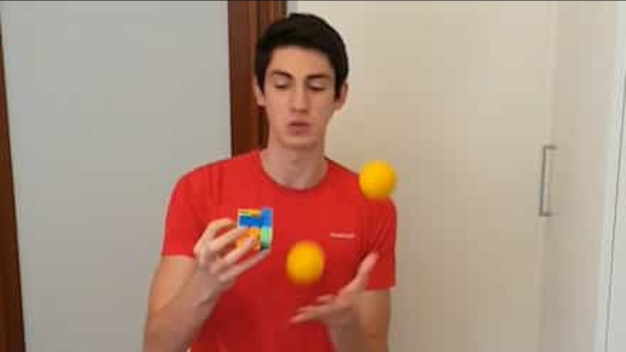 Juggler solves Rubik's Cube and says Pi at the same time!