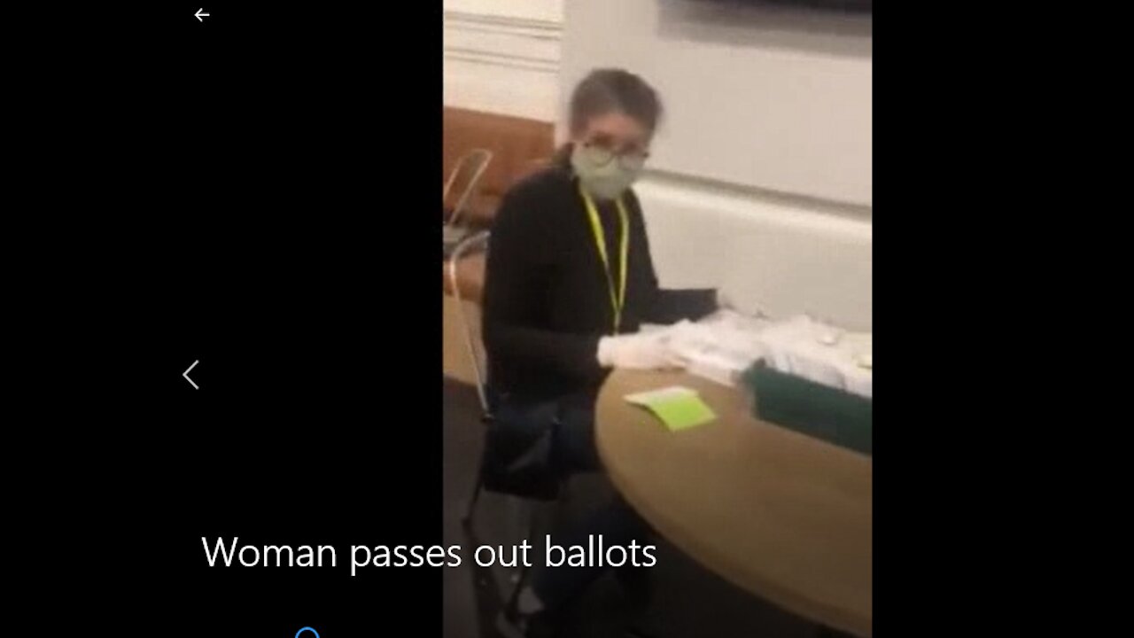 Woman Filling Out Ballots At Polling Station Possibly Identified