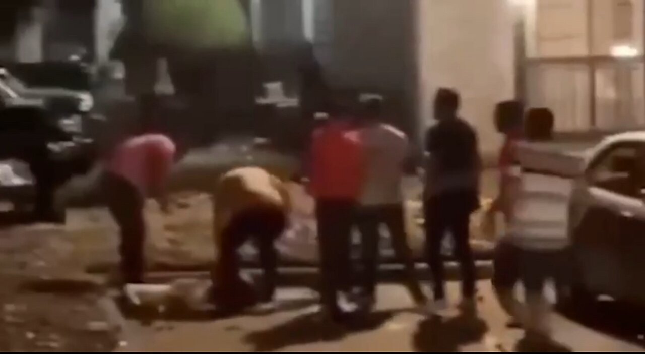 Illegal Venezuelan migrants beat a man unconscious while gunfire erupts in the distance