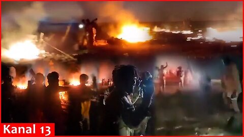 The rebels show with great joy the burning of the Russian cargo planes
