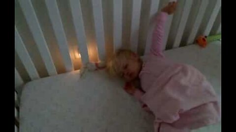 Cute baby girl refuses to get out of bed