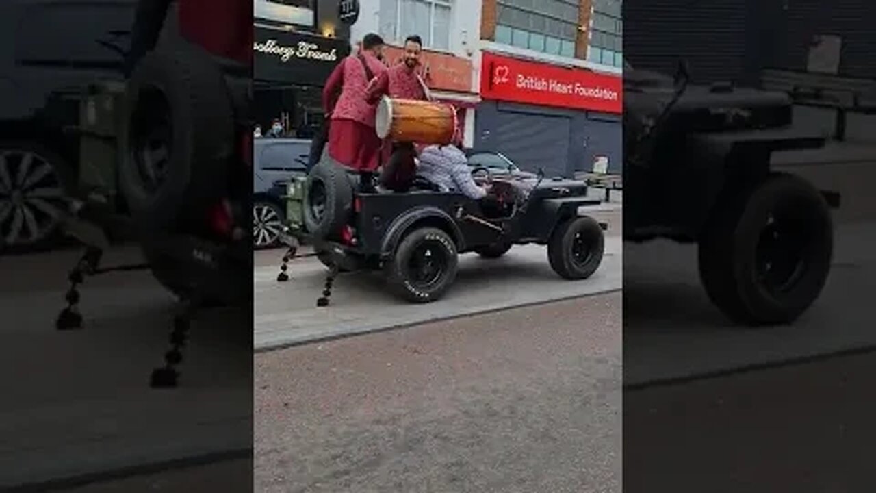 Filming video at Southall Broadway London UK