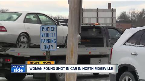 Woman found shot in car, suspect on the loose
