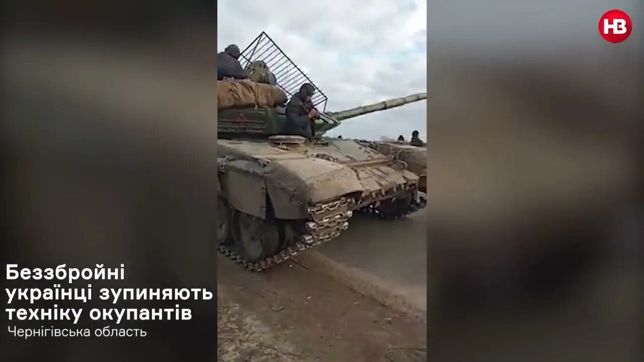 The Ukrainian Townspeople of Koryukivka Block Russian Tanks