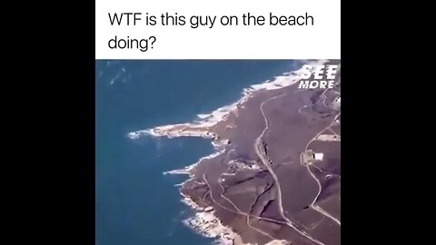 What is this guy on the beach doing? #shorts