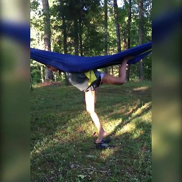 Girl Tries To Hang Upside Down In A Hammock But Fails