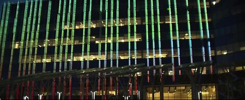 Las Vegas City Hall lit up in crimson and gold