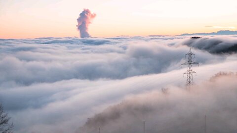 Reflection of sunrise on a sea of ​​fog