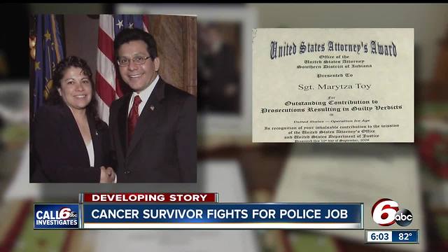 Breast cancer survivor fights for job as police officer