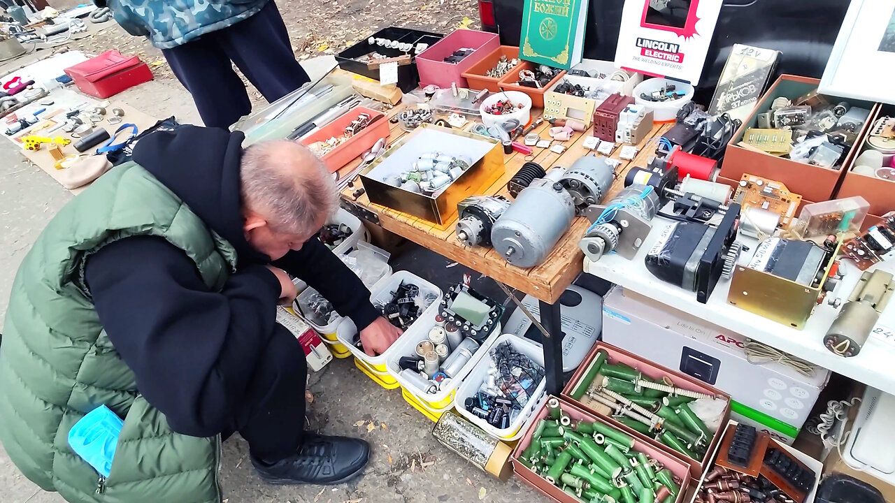 How can you make money on old unnecessary things ? Autumn flea market after the rain.