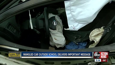 Mangled car sits outside Newsome High School ahead of 'Trauma is No Accident' event on Tuesday