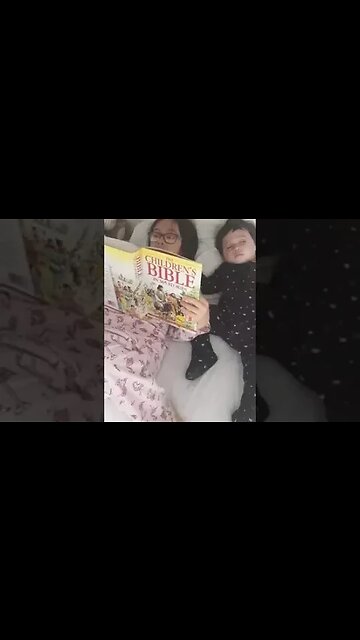 Big sister is reading the Bible to her baby brother and baby sister-cuteness overload