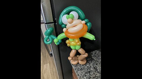Balloon twisting a leprechaun