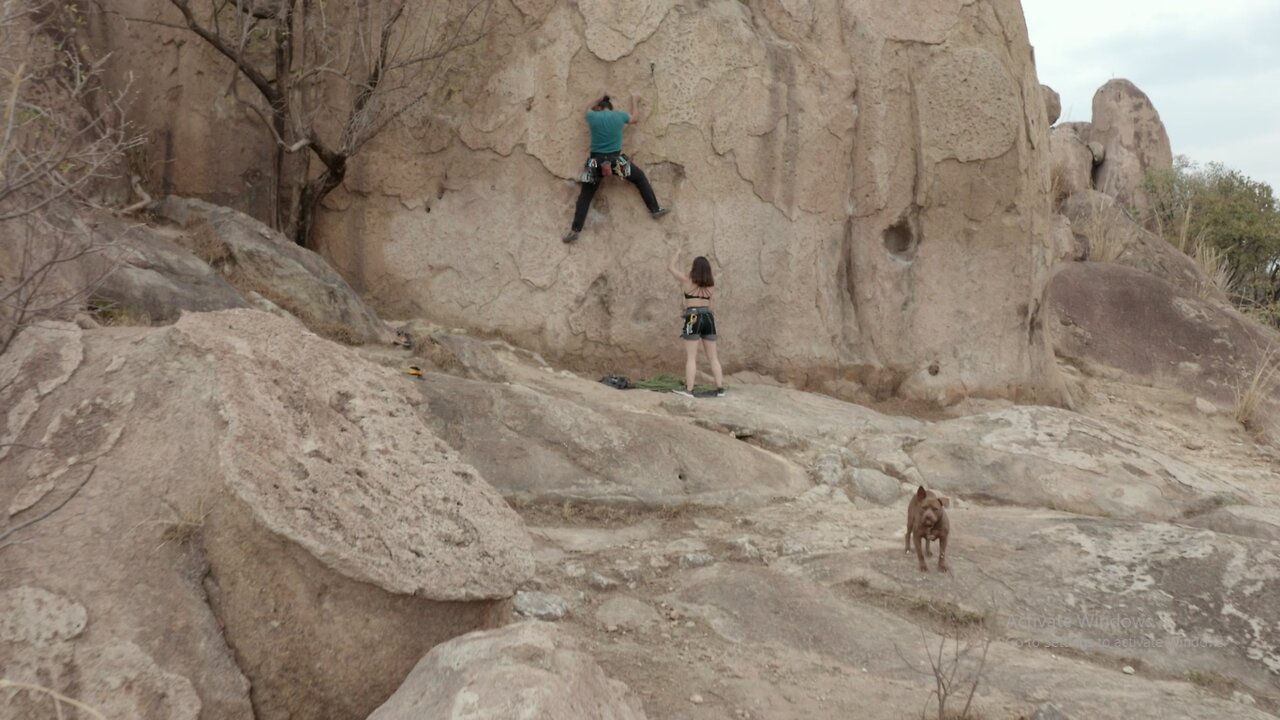 Man and woman in nature practicing mountaineering