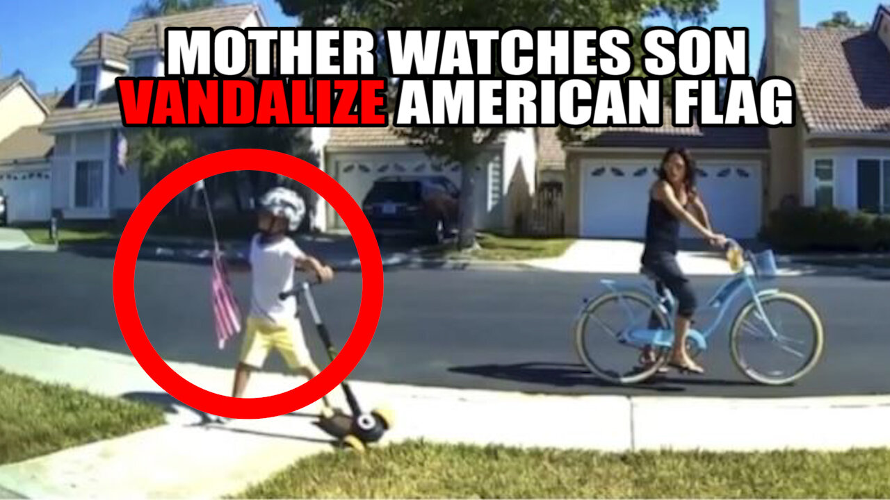 Mother Watches As Young Child Vandalizes American Flag